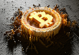 en bitcoin uppbyggd av små pixlar som kommer upp ur marken.jpg