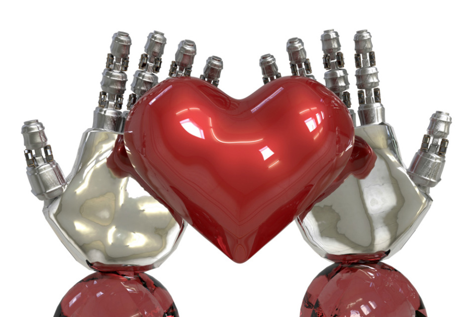 två robothänder håller ett upplåst rött hjärta i sina händer.jpg