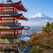 ett japanskt tempel i förgrunden och ett snötäckt berg i bakgrunden.jpg