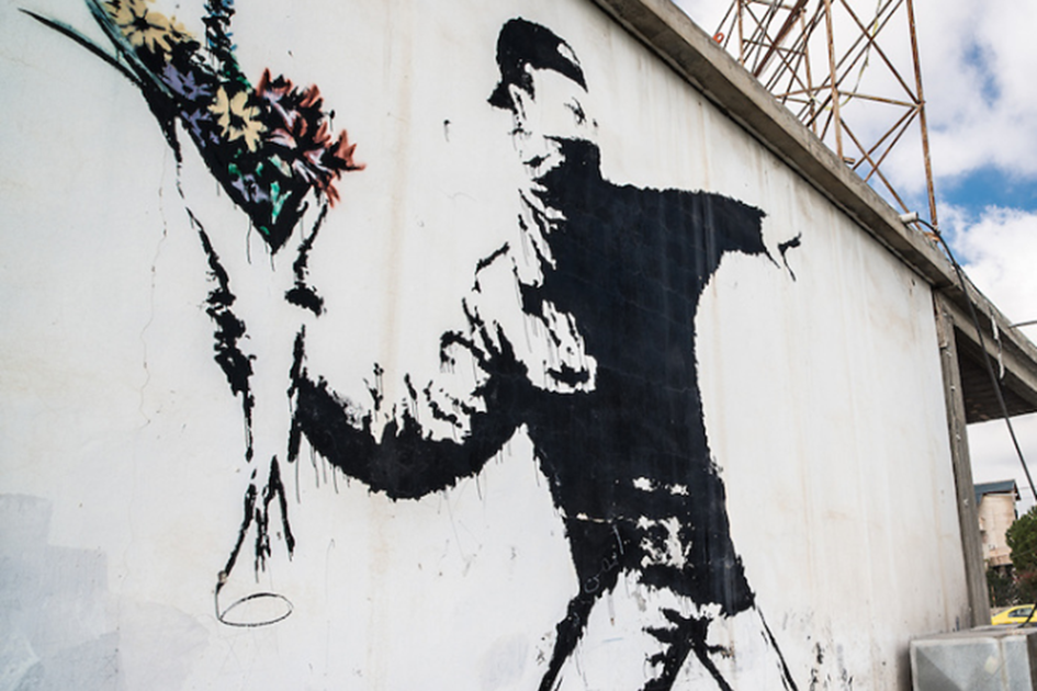 Banksys Love Is In The Air Graffiti I Bethlehem